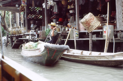 Man Sitting by Boat